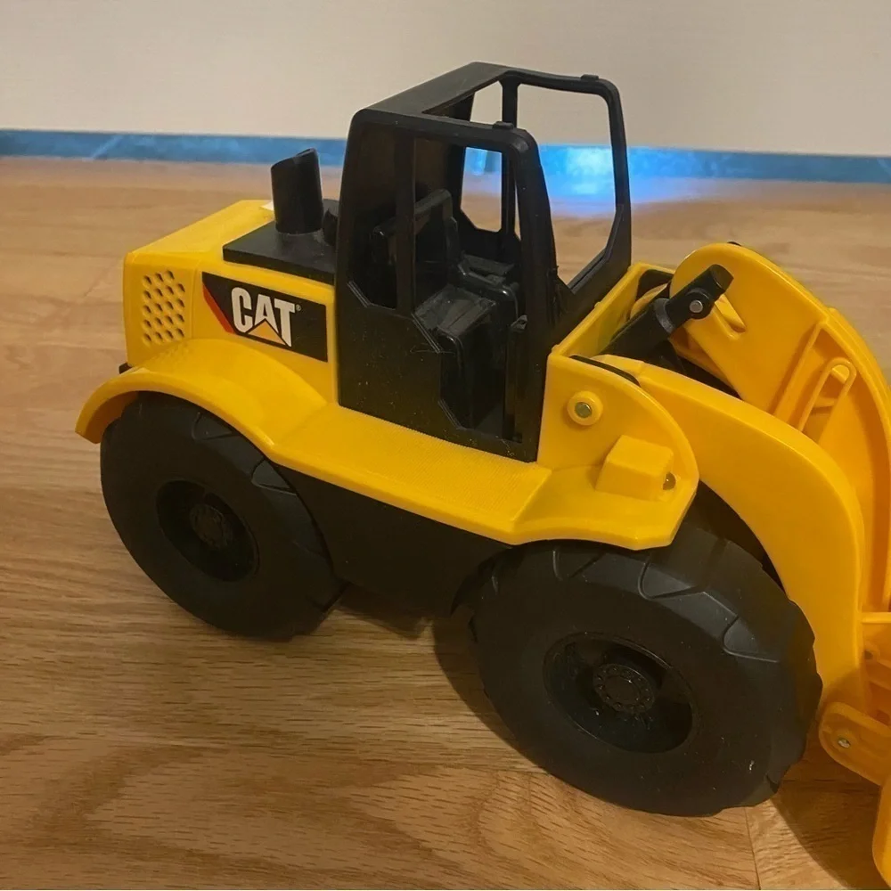 Caterpillar Job Site Machine Wheel Loader Moving Button Activated Up and Down